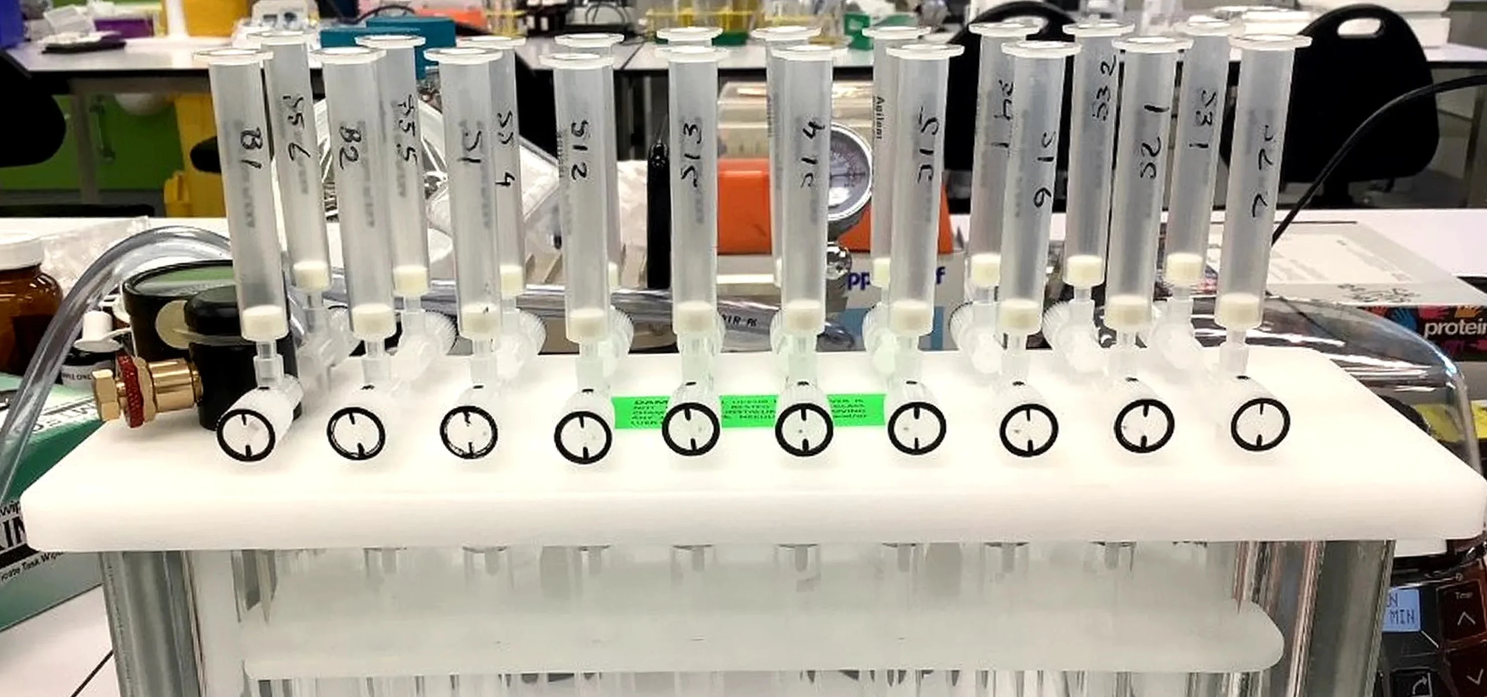 A ten-cartridge solid-phase extraction manifold set up for blood-plasma processing.